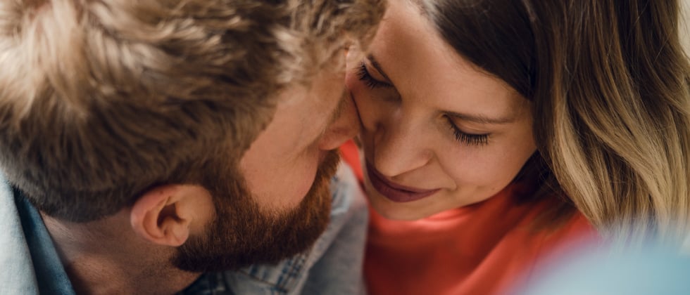 Man and woman close up close up as a symbol for how to attract a man