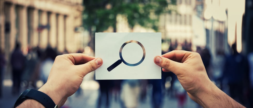 Magnifying glass as a symbol of how to find a polyamorous relationship